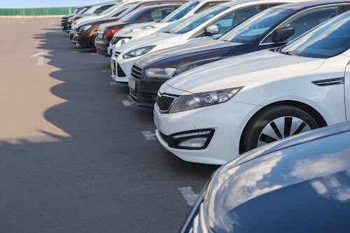 A row of 10 used cars for sale